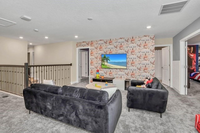 carpeted living room featuring a textured ceiling