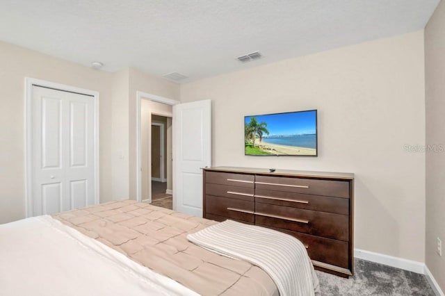 carpeted bedroom featuring a closet