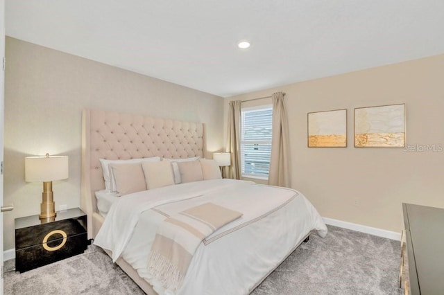 bedroom with light colored carpet