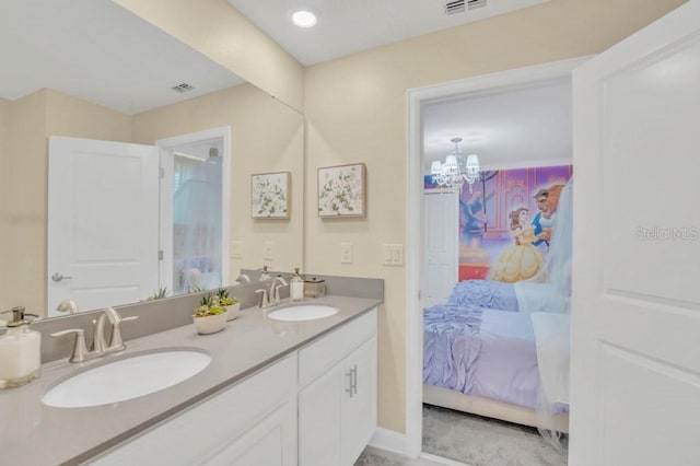 bathroom featuring a chandelier and double sink vanity