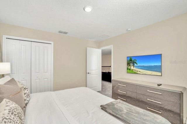 carpeted bedroom with a closet