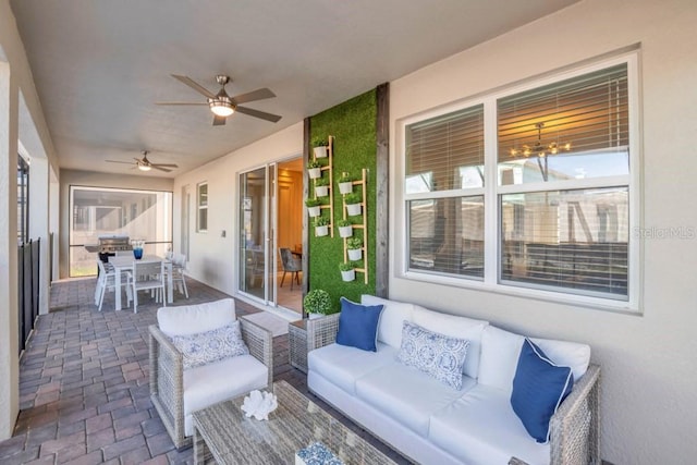 exterior space featuring ceiling fan with notable chandelier