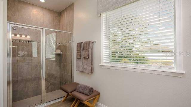 bathroom with a shower stall