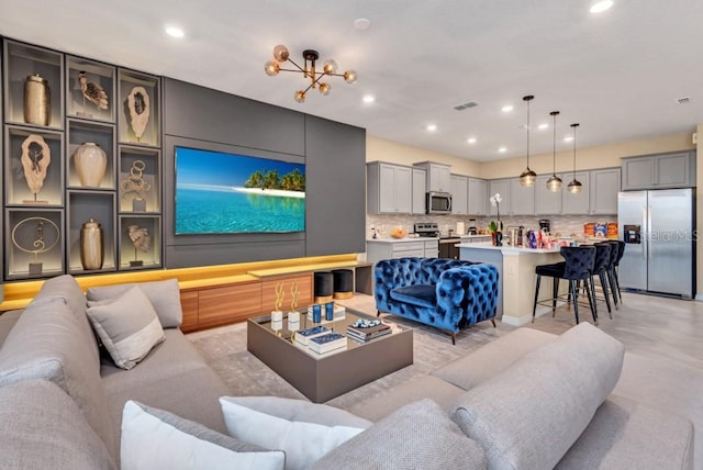 living room with a notable chandelier