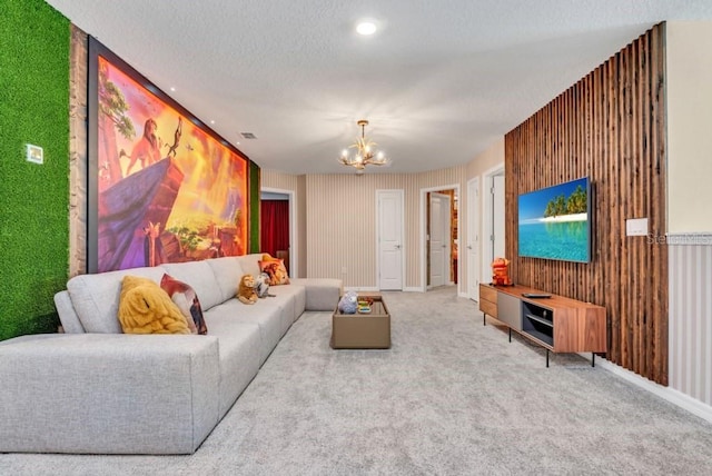 carpeted living room with wooden walls, a notable chandelier, and a textured ceiling