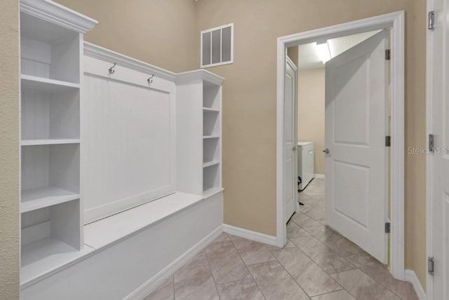 mudroom with light tile flooring