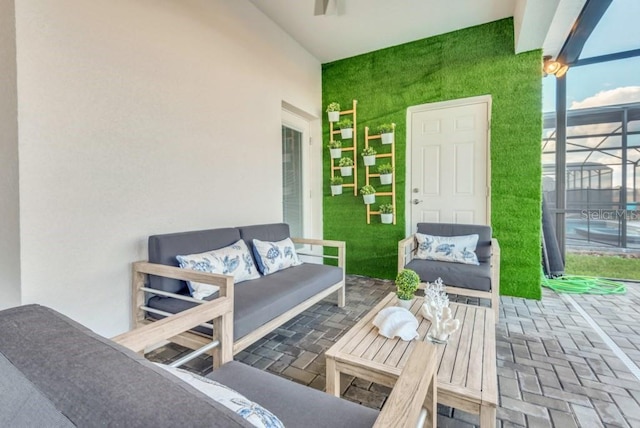 view of patio featuring outdoor lounge area and a lanai