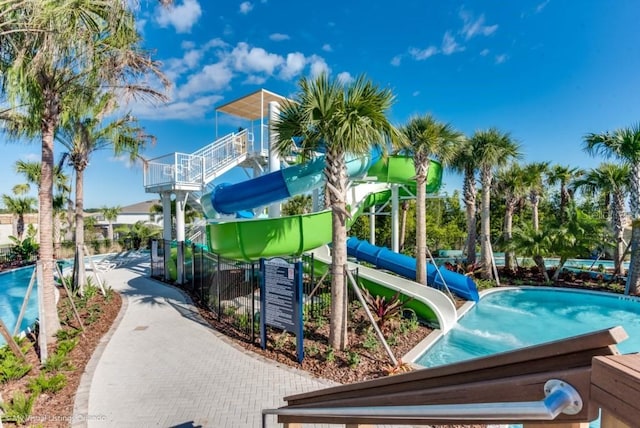 view of playground featuring a community pool