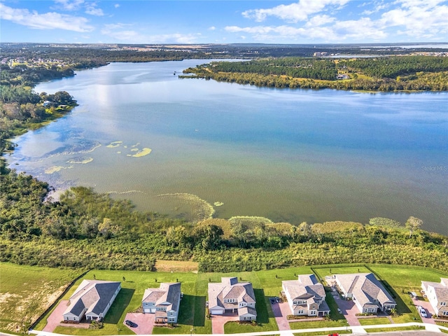 birds eye view of property with a water view