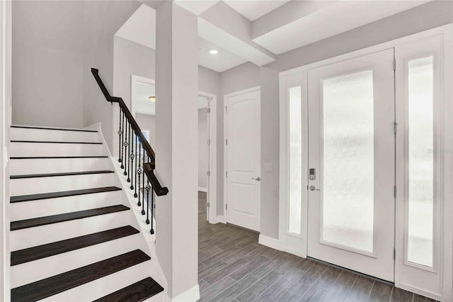 foyer entrance featuring dark hardwood / wood-style floors