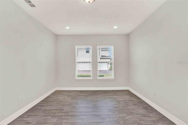 empty room featuring wood-type flooring