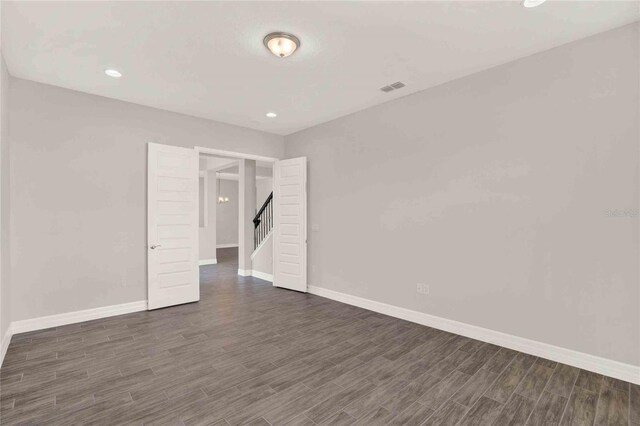 unfurnished room featuring dark hardwood / wood-style floors