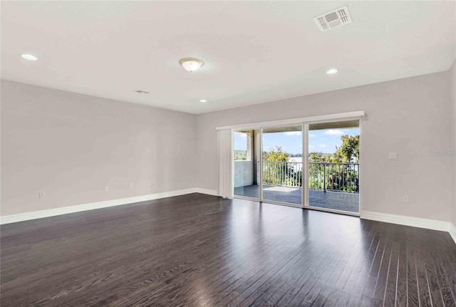 unfurnished room featuring dark wood-type flooring