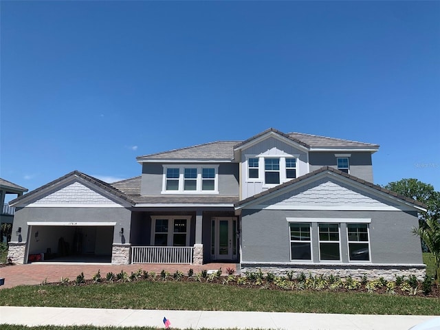 view of front of home featuring a garage and covered porch