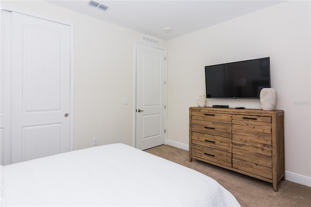 carpeted bedroom with a closet