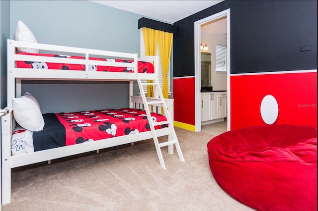 carpeted bedroom with ensuite bathroom