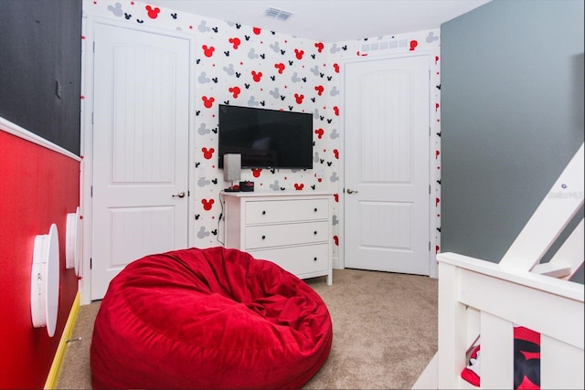 bedroom featuring light carpet