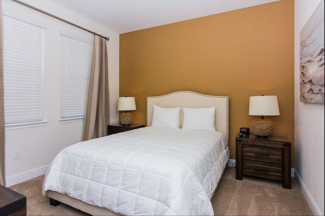 bedroom featuring light carpet