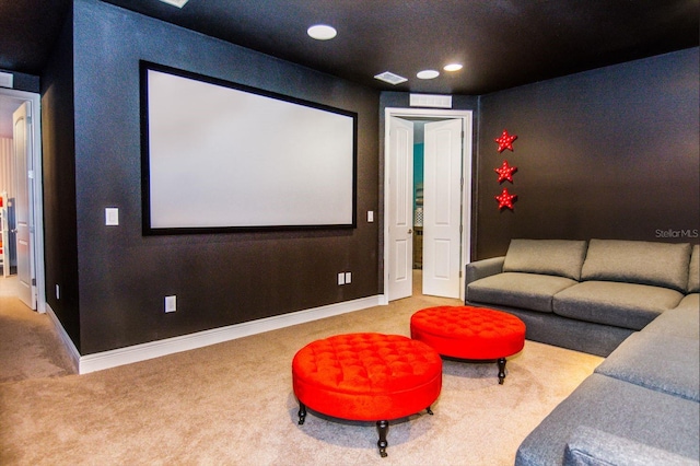 home theater featuring light carpet