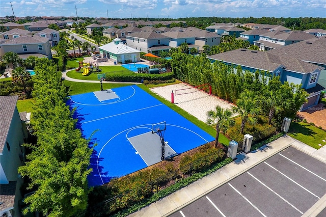 view of sport court featuring a yard