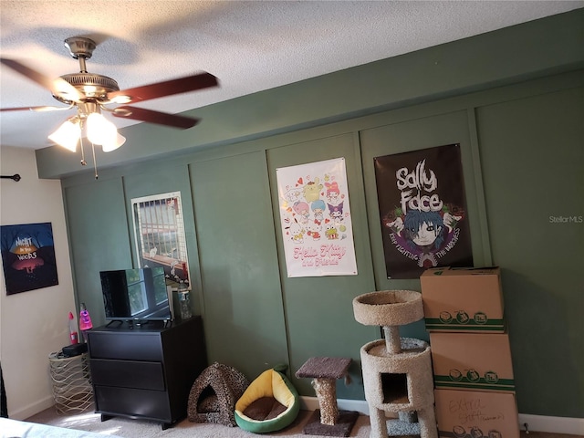 rec room with light carpet, a textured ceiling, and ceiling fan