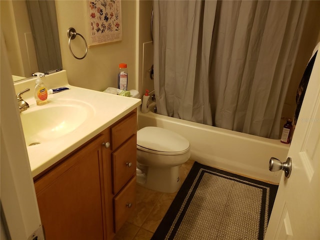 full bathroom with shower / tub combo, vanity, tile flooring, and toilet