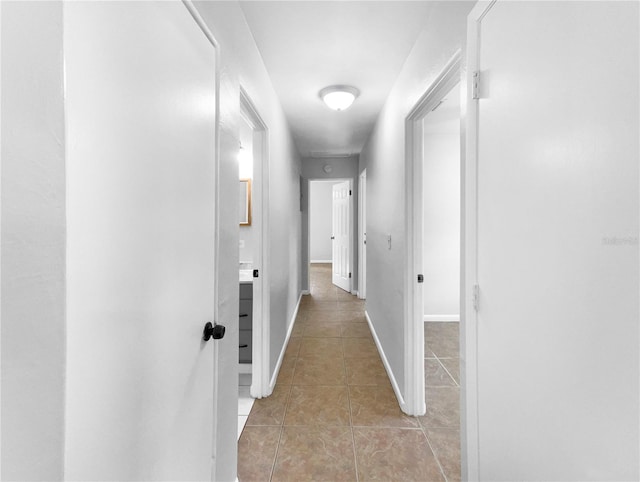 hallway featuring light tile patterned flooring