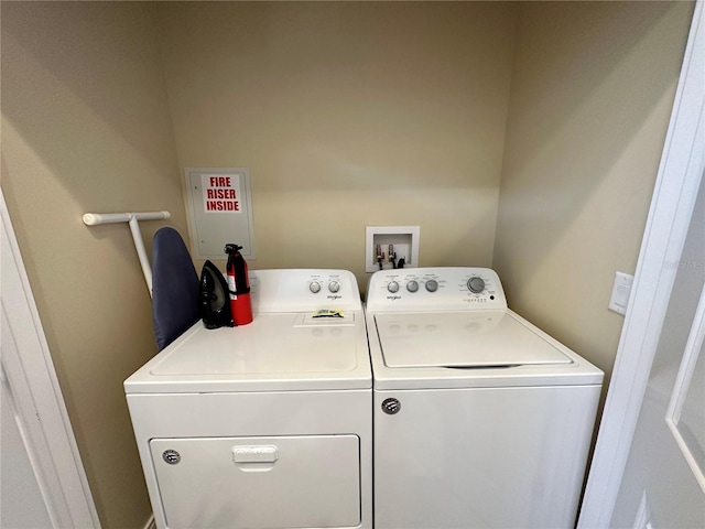 laundry room featuring washing machine and dryer