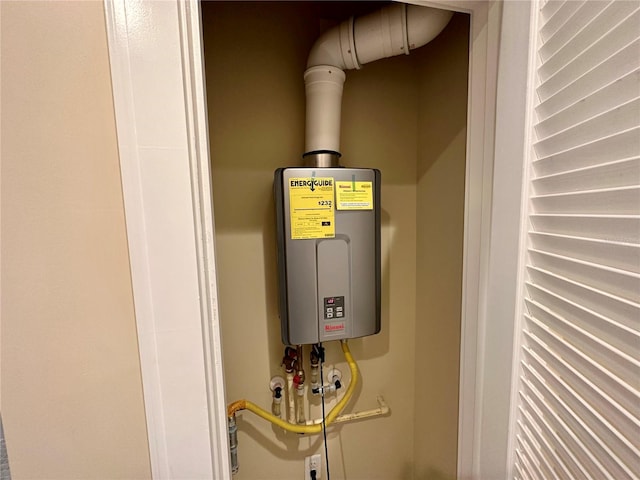 utility room featuring tankless water heater