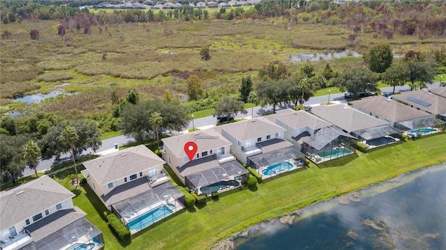 drone / aerial view featuring a water view and a residential view