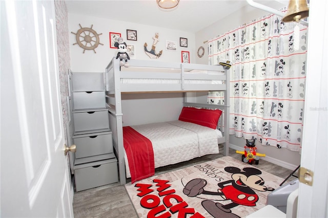 bedroom with wood finished floors