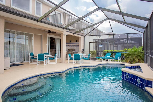 outdoor pool featuring outdoor dining area, grilling area, a ceiling fan, a patio area, and exterior kitchen