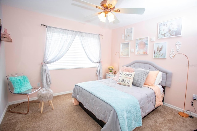 bedroom featuring light carpet, ceiling fan, and baseboards