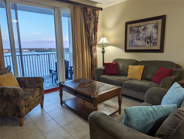 tiled living room featuring crown molding and a water view