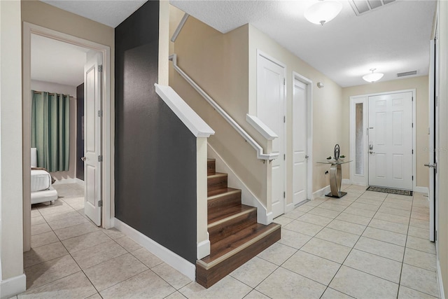 entrance foyer featuring light tile flooring