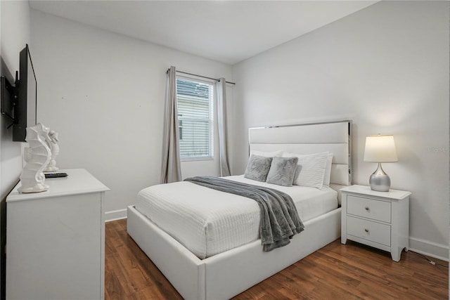 bedroom featuring dark hardwood / wood-style flooring