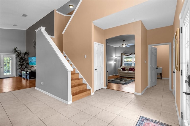 entryway with ceiling fan and light hardwood / wood-style flooring