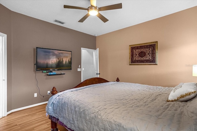 bedroom featuring ceiling fan and light hardwood / wood-style flooring