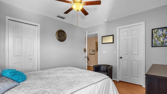 bedroom featuring ceiling fan and light hardwood / wood-style flooring