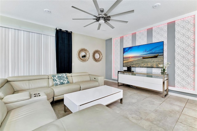 living room featuring ceiling fan and light tile floors