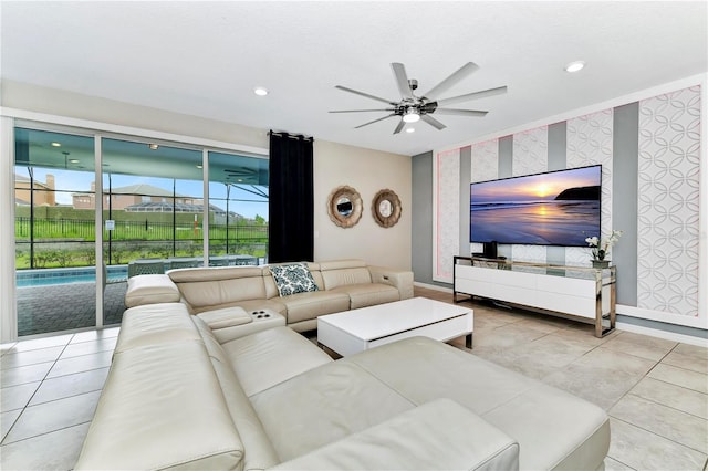 tiled living room with ceiling fan