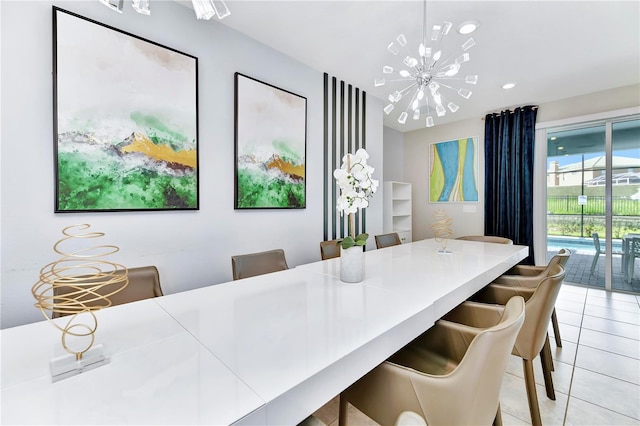 tiled dining area featuring a chandelier