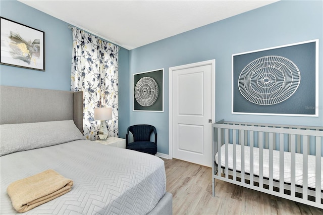 bedroom featuring light hardwood / wood-style floors