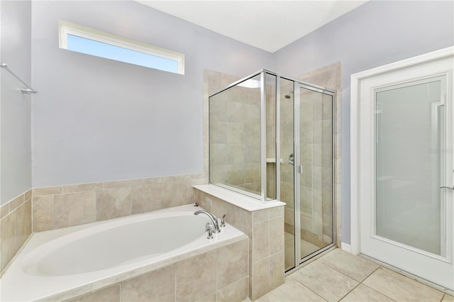 bathroom with tile floors and separate shower and tub