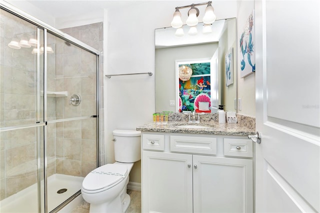 bathroom featuring toilet, tile floors, an enclosed shower, and vanity