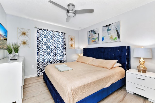 bedroom featuring ceiling fan and light wood-type flooring