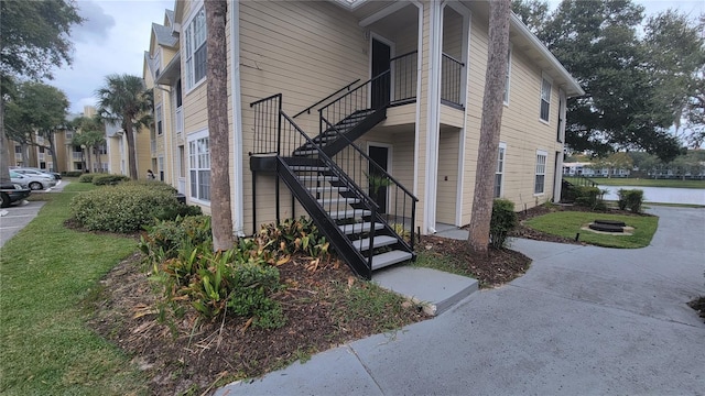 view of side of property with a lawn