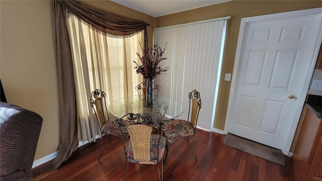 dining space with dark wood-type flooring