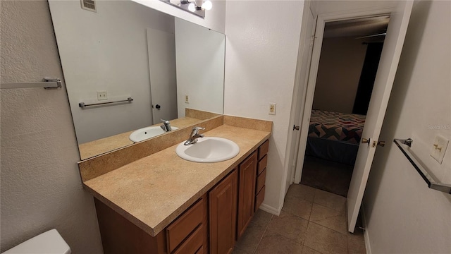 bathroom with tile flooring and large vanity