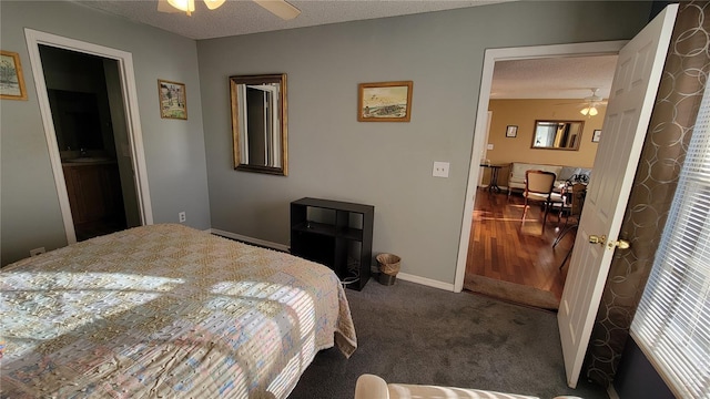 carpeted bedroom featuring a textured ceiling, ceiling fan, and sink